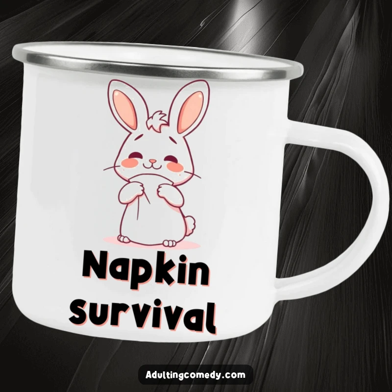 Funny bunny camping mug showing a cheerful but confused rabbit attempting to fold a giant napkin, great for outdoor gifts.