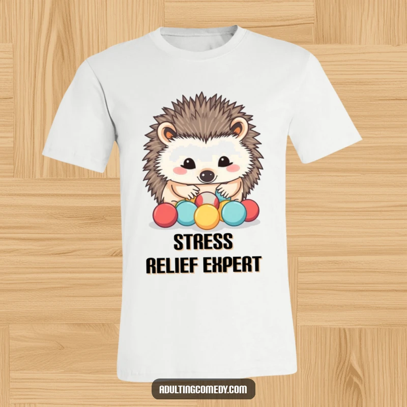 Funny Hedgehog T-Shirt: A determined hedgehog carefully sorts tiny stress balls with its nose, offering a humorous take on dealing with pressure.