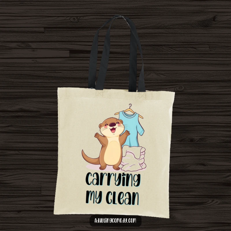 Funny otter tote bag depicting a joyful animal dancing next to a pile of clean laundry, perfect for a funny gift.